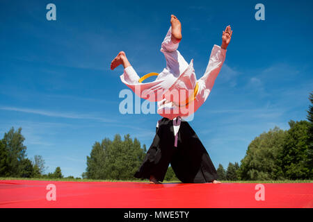 Two karate men fighting in a outdoor Stock Photo