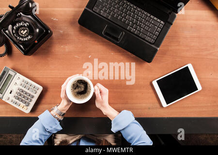 top view, business woman drinking coffee at the desk Stock Photo