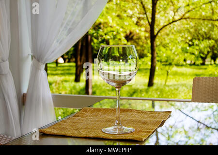 image of empty goblet on high stalk empty in gazebo Stock Photo