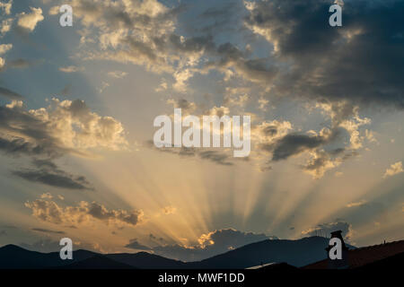 Strange atmosphere like of "universal judgment" in the sky above the houses Stock Photo