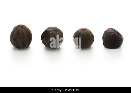 dried persian black lime, limu amani isolated on white background Stock Photo