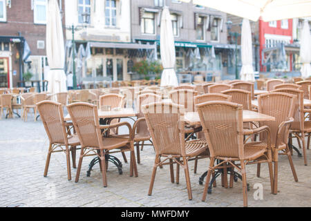 Tables in a cafe on the square of Bergen op Zoom in Holland. Travel in Europe. Netherlands. Stock Photo