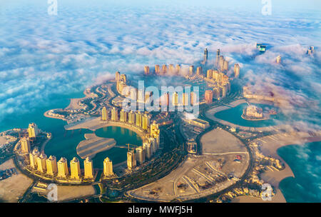 Aerial view of the Pearl-Qatar island in Doha through the morning fog - Qatar, the Persian Gulf Stock Photo