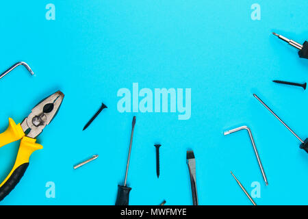 Set of various tools on blue wooden background. Construction and renovation concept with copy space Stock Photo
