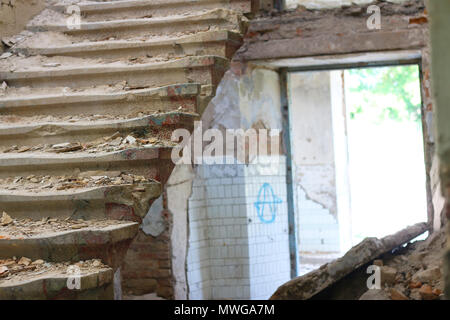 destroyed stairs and light entrance Stock Photo