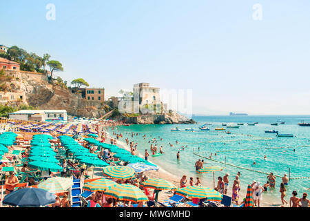 ERCHIE, ITALY - 31 AUGUST, 2017: small crowded Italian beach in fishing village of Erchie on hot summer day on Amalfi coast Stock Photo