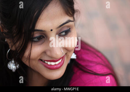 Beautiful Indian woman in traditional clothing, smiling at camera. Stock Photo