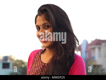Beautiful Indian woman in traditional clothing, smiling at camera. Stock Photo