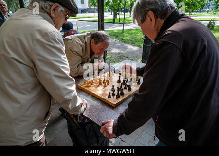 Odessa, Ukraine. 31st Mar, 2022. Elderly men play chess at the