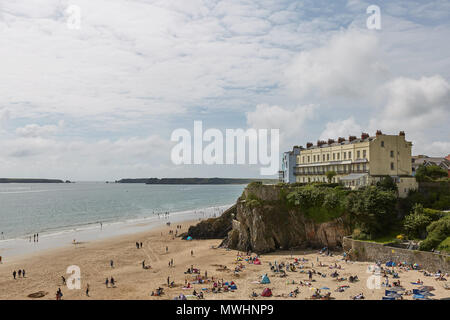 TENBY, WALES, UK - AUGUST 13, 2017: People enjoying the harbour and Castle at Tenby, an ancient walled town; now a tourist destination in the county o Stock Photo