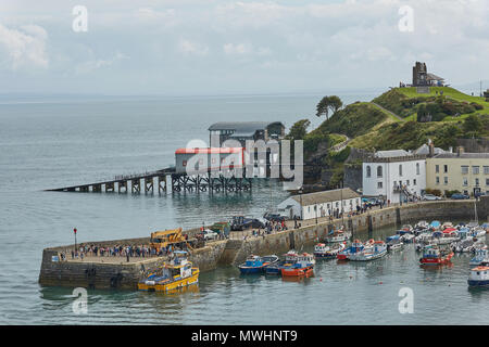 TENBY, WALES, UK - AUGUST 13, 2017: The harbour and Castle at Tenby, an ancient walled town; now a tourist destination in the county of Pembrokeshire, Stock Photo