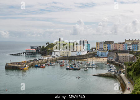 TENBY, WALES, UK - AUGUST 13, 2017: The harbour and Castle at Tenby, an ancient walled town; now a tourist destination in the county of Pembrokeshire, Stock Photo