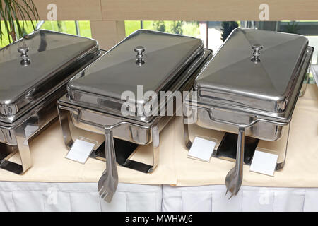 Stainless Steel Food Warmer at Buffet Table Stock Photo