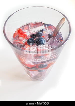 Cold fresh drink with fruits and ice. Summer refreshment. Water in glass. Stock Photo
