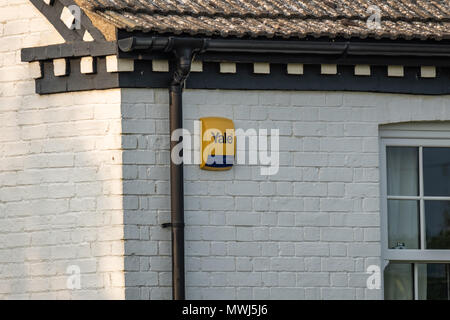 Isolated view of a residential Alarm and warning strobe seen fitted to the outside of a bricked house in the UK capital. Stock Photo