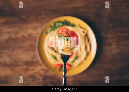 selective focus of traditional italian pasta on fork Stock Photo