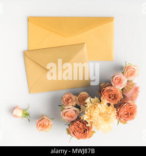 beautiful pink roses and envelopes isolated on white Stock Photo