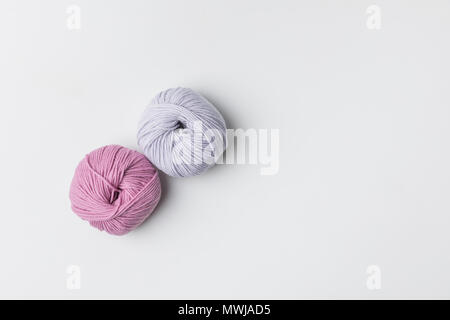 top view of two yarn balls isolated on white with copy space Stock Photo