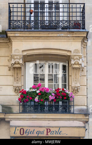 Colorful geraniums along a window balcony in Montmartre, Paris, France Stock Photo