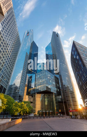 Setting sunlight over the financial district and modern architecture of La Defense, Paris France Stock Photo