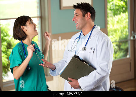 Team of diverse healthcare providers helping patients. Stock Photo