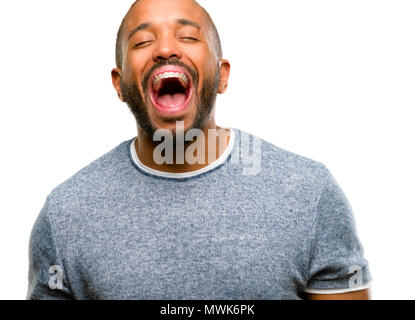 African american man with beard stressful, terrified in panic, shouting exasperated and frustrated. Unpleasant gesture. Annoying work drives me crazy  Stock Photo