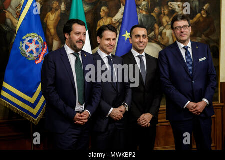 Rome, Italy. 01st June, 2018. New Italian Prime Minister Giuseppe Conte receives a silver bell from former Prime Minister Paolo Gentiloni during the bell ceremony, to signify the start of the first cabinet meeting of newly appointed Italian Government, at the Chigi Palace in Rome, Italy on June 01, 2018. Credit: Giuseppe Ciccia/Pacific Press/Alamy Live News Stock Photo