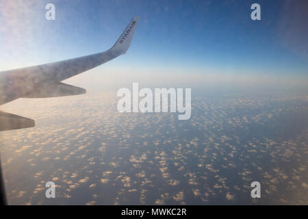 Airbus wing Ryanair, view true window, Europe Stock Photo