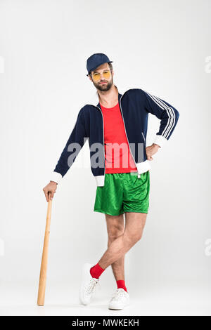 retro baseball player posing in cap with baseball bat, isolated on white Stock Photo