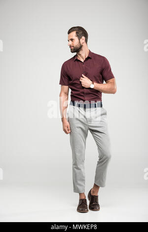 handsome elegant man posing in casual closing isolated on grey mwkep8