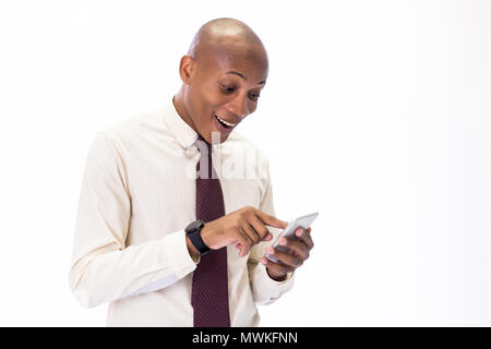 Excited and Happy African American man wearing a shirt and a tie talking on the phone, overwhelming with good news and happiness Stock Photo