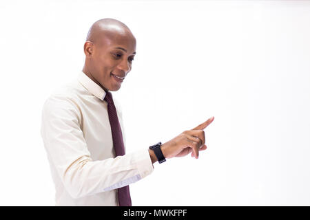 Attractive African American man wearing formal wear with tie, touching a virtual screen. It can be used for layout in touch screen related words and o Stock Photo