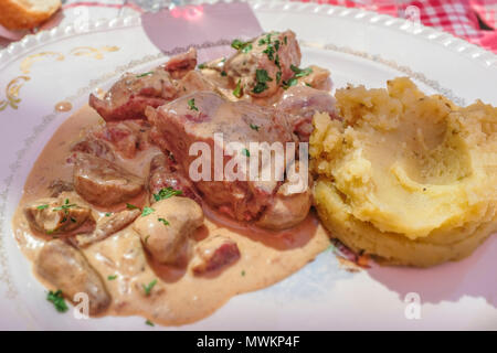 Beef cheeks with mashed potatoes on table Stock Photo