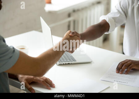 Close up of work employer shaking hand of job applicant Stock Photo