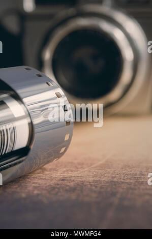 Still life of a vintage camera and roll of film Stock Photo