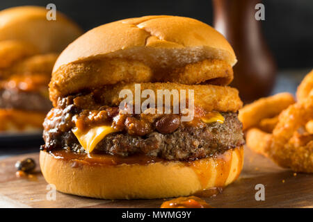 Homemade Barbecue Chili Cheeseburger with Onion Rings Stock Photo