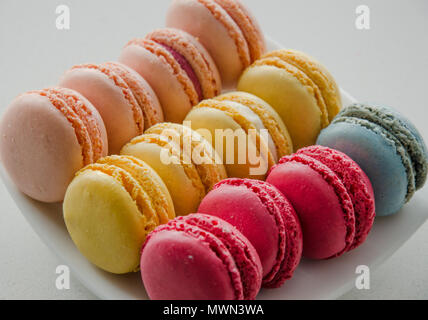 Delicious Colourful French Macarons on a plate as delicate savory dessert Stock Photo