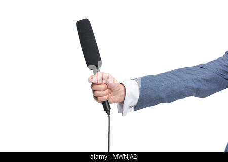 cropped view of male hand holding microphone for interview, isolated on white Stock Photo