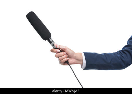cropped view of female hand holding microphone for interview, isolated on white Stock Photo
