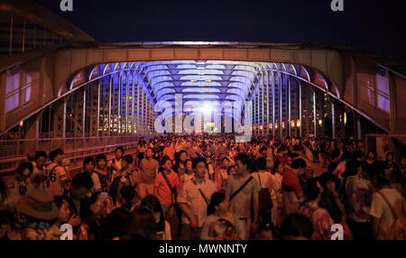 Osaka, Japan - July 25, 2015: Crowd walks over the Genpachi Bridge after the fireworks display during the Tenjin Matsuri summer festival Stock Photo