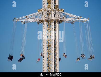 Riders on an amusement ride in Djurgården park Stockholm, Sweden Stock Photo