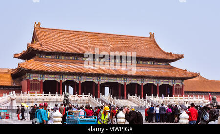 Beijing, China - Apr. 18, 2018: Tourists visit the Gate of Supreme Harmony in the Forbidden City, Beijing, China. Stock Photo