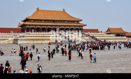 Beijing, China - Apr. 18, 2018: Tourists visit the Hall of Supreme Harmony in the Forbidden City, Beijing, China. Stock Photo