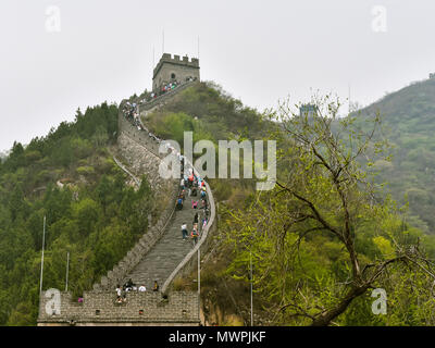 Juyongguan Pass, Badaling/China - Apr. 19, 2018: Tourists climb the Great Wall of China at Juyongguan Pass, Badaling. Stock Photo