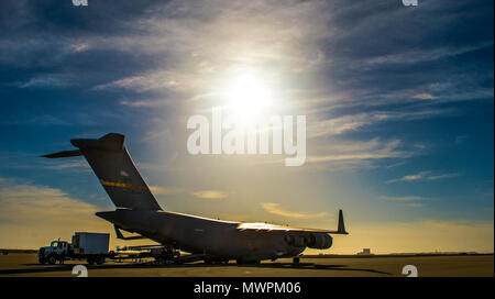 Members from the 26th Aerial Port Squadron load a communications vehicle from the U.S. Coast Guard's Mobile Contingency Communications Detachment West, onto an awaiting C-17 Globemaster III from March Air Reserve Base, California on April 27, 2017 at Vandenberg Air Force Base, California. Patriot Hook is an annual joint-service exercise coordinated by the Air Force Reserve, designed to integrate the military and first responders of federal, state and local agencies by providing training to mobilize quickly and deploying in military aircraft in the event of a regional emergency or natural disas Stock Photo