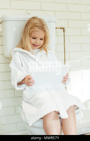 Sitting On Toilet High Resolution Stock Photography and 