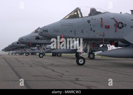 Seven U.S. Air Force A-10 Thunderbolt IIs, from the 127th Wing, Michigan Air National Guard, Selfridge Air National Guard Base, Mich., sit on the flightline at RAF Mildenhall, England, June 1, 2018. The Thunderbolts are passing through RAF Mildenhall on their way to support the U.S. Army Europe-led exercise Saber Strike 2018. Saber Strike 18 promotes regional stability and security while strengthening partner capabilities. (U.S. Air Force photo by Airman 1st Class Benjamin Cooper) Stock Photo