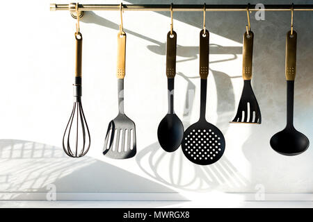 close-up view of various utensils hanging in kitchen Stock Photo