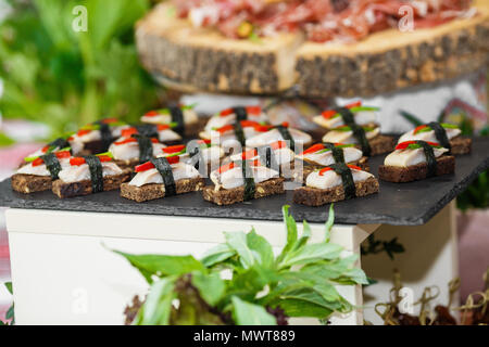 Beautifully decorated catering banquet table with different food Stock Photo