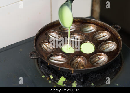 preparing or cooking KUIH CARA MANIS, a malay traditional cuisine in malaysia. made from mixing flour,water and pandan leaf Stock Photo